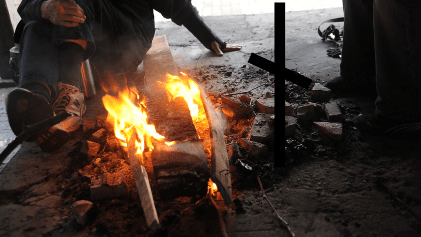 Needy men around fire with Nauthiz Rune